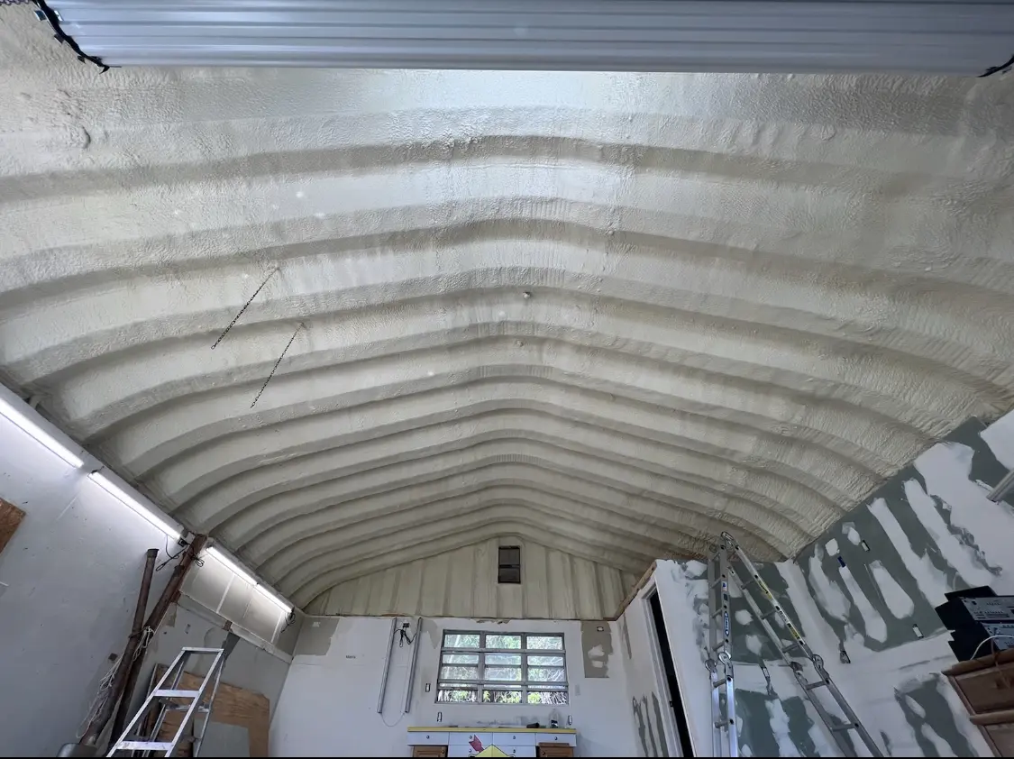 Spray polyurethane foam applied to the underside of a metal roof deck in San Elizario